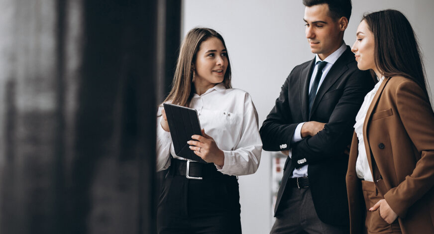 Male and female business people working on tablet in office